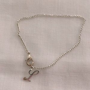 Silver tone L bracelet